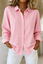 Blusa minimalista mujer corte holgado con botones frontales