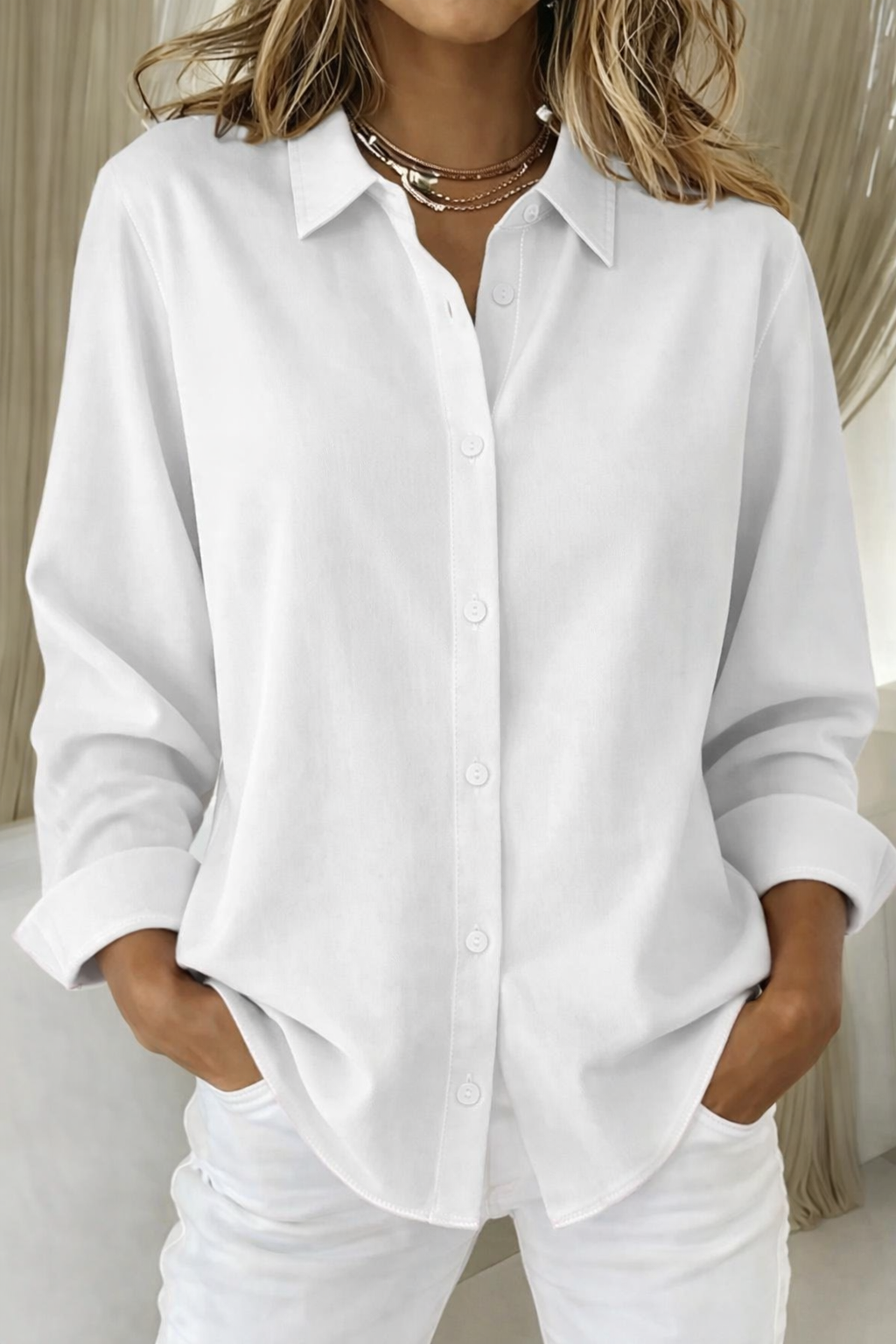 Blusa minimalista mujer corte holgado con botones frontales