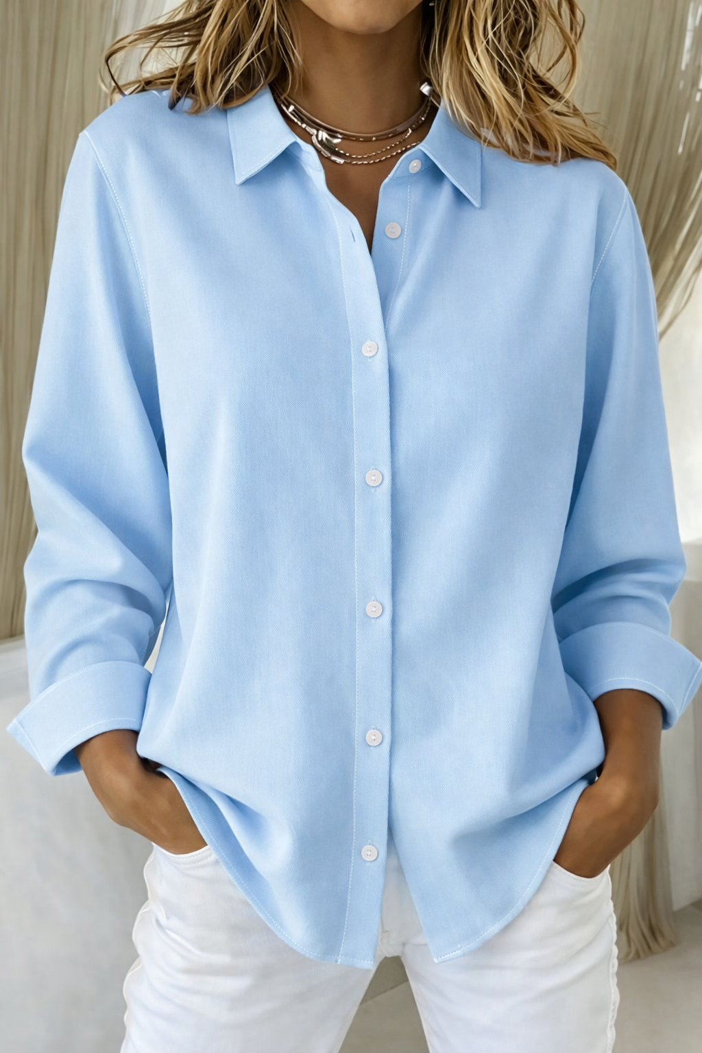 Blusa minimalista mujer corte holgado con botones frontales